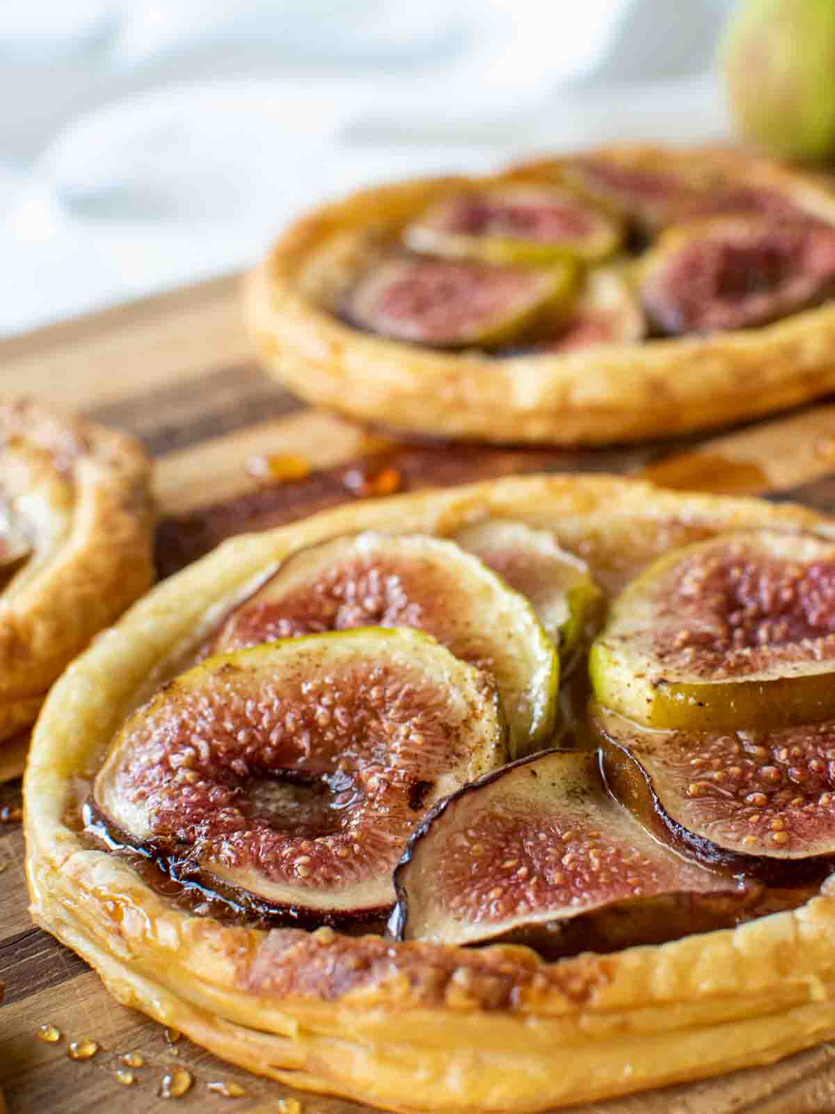close up of slices of fresh figs baked on puff pastry.