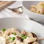 image with text. text reads "creamy tortellini alla panna". image is bowl of tortellini with peas and ham.