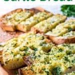 image with text. text reads "easy homemade ciabatta garlic bread". Image is slice of toasted ciabatta bread topped with herbs.