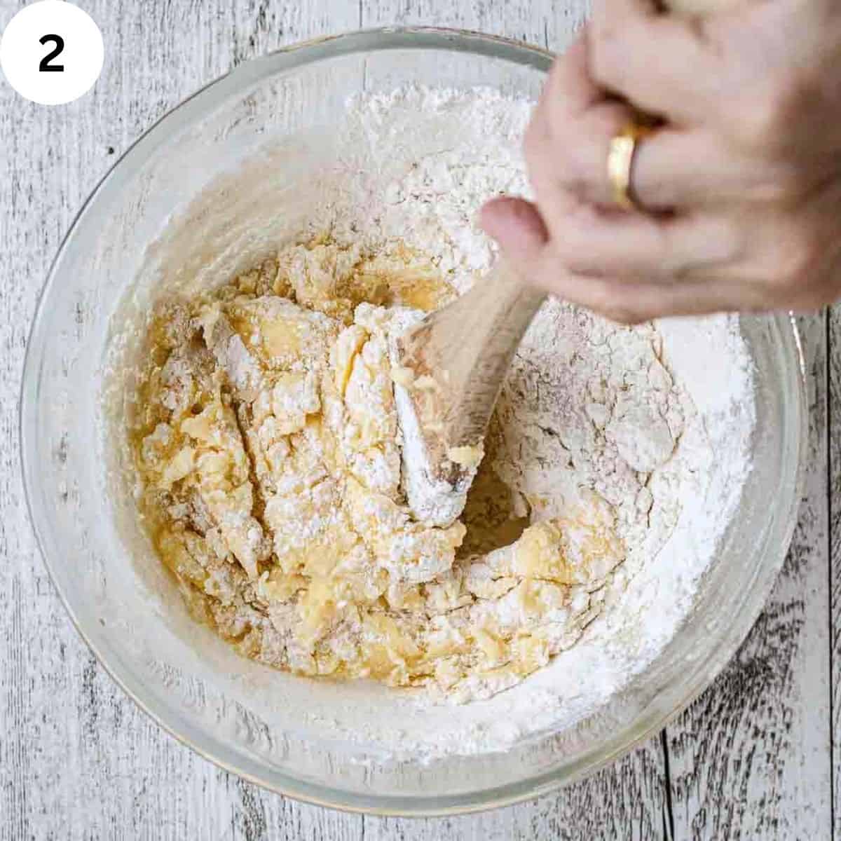 Flour being stirred into a butter mixture.