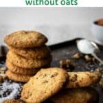 Coconut Pecan Cookies piled up onto a baking sheet.