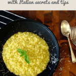 Yellow risotto on black plate