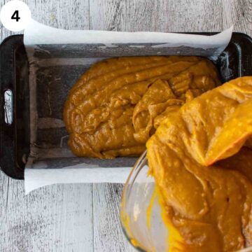 Orange batter being poured into a loaf pan.