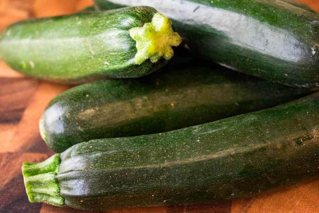 Four green zucchini.