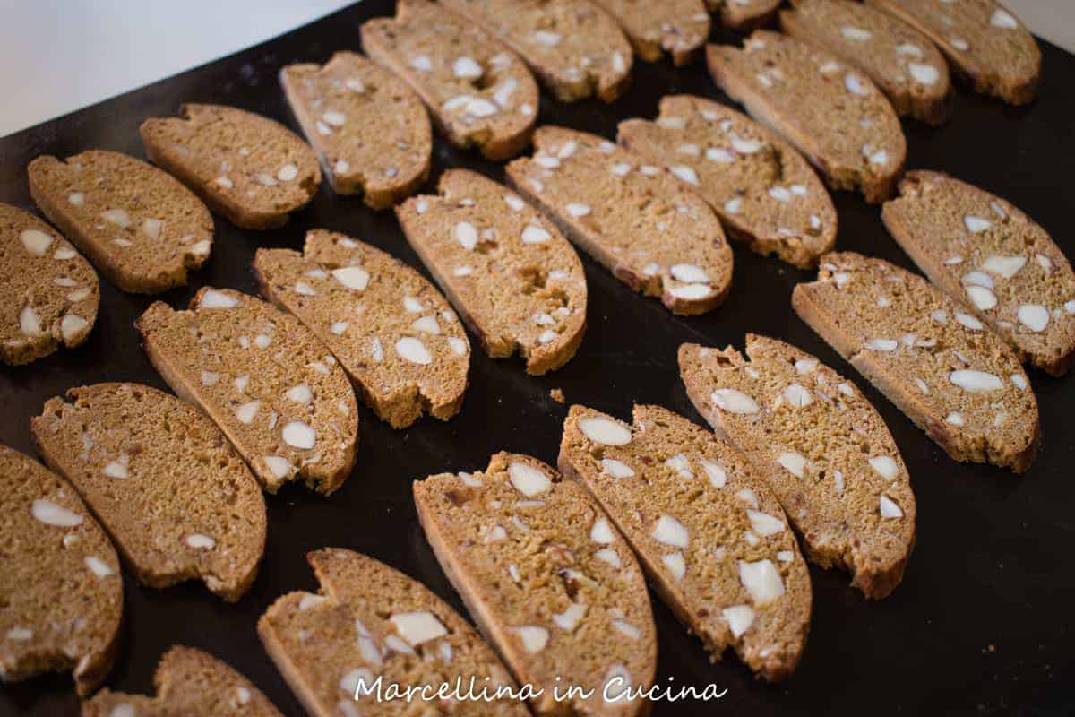 Italian Piparelli are traditional spicy biscotti perfect for dunking. #biscotti #italianrecipe #recipe #cookie #piparelle #sicilian black tray of Italian piparelli - spicy cookies