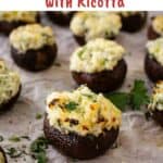Ricotta stuffed mushrooms arranged on parchment paper.