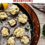 Ricotta stuffed mushrooms arranged on parchment paper.