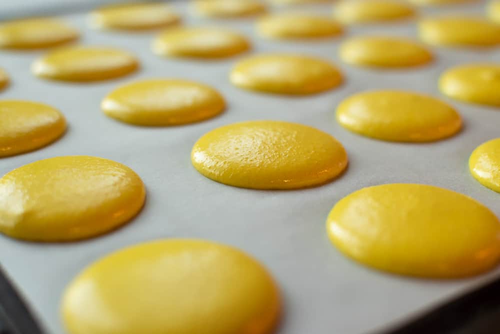 Lemon Macarons #lemonmacarons #lemon #macarons #macaron Yellow macarons ready for baking