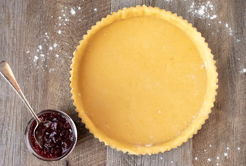 This Strawberry Crostata recipe | Easy Strawberry Tart is an easy Italian pastry filled with fruity jam #strawberrycrostata #crostatarecipe #strawberrytart #crostatadough crostata dough ready for filling for strawberry crostata recipe.