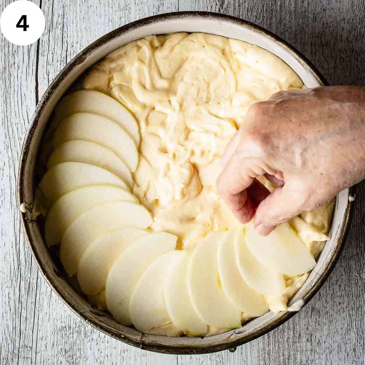 Arranging apple slices in concentric circle on top of cake batter.