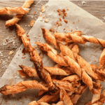 pile of puff pastry twists with prosciutto and parmesan