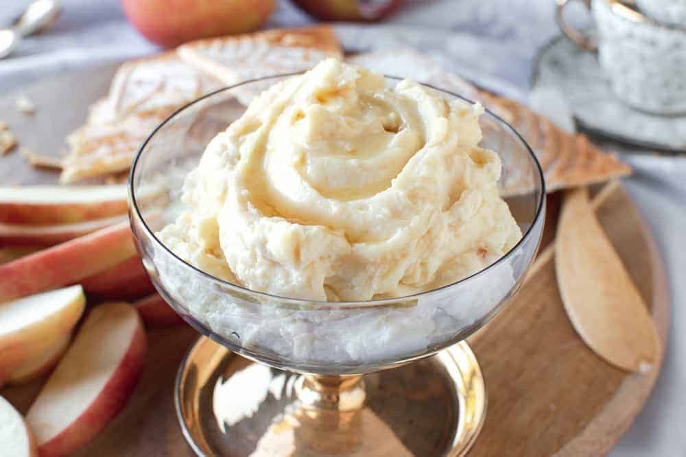 sweet ricotta on a board with apple slices and pizzelle