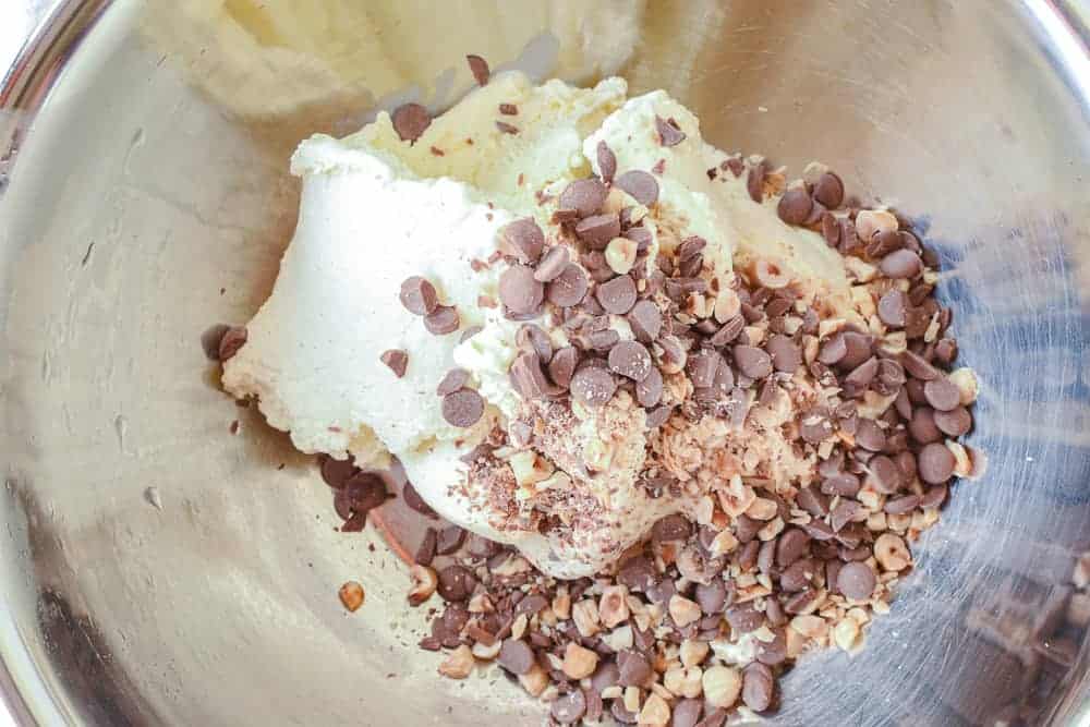 Christmas Ice cream pudding is made with store bought ice cream so it's perfect for that last minute impressive Christmas dessert . #christmaspudding #icecreampudding #christmasicecreamdessert #icecreamdessert #pudding #dessert vanilla ice cream, choc drops and hazelnuts