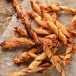 pile of puff pastry twists with prosciutto and parmesan