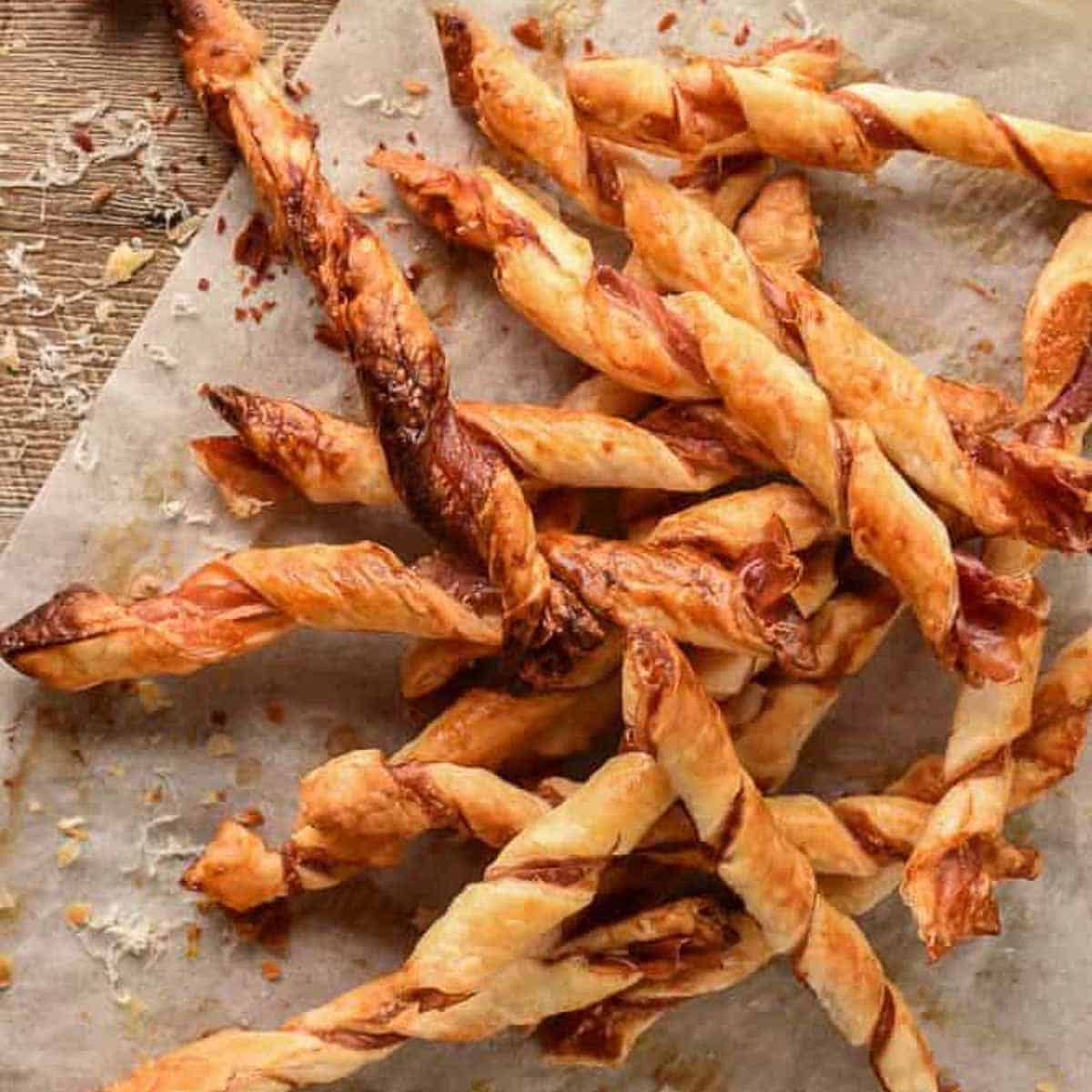pile of puff pastry twists with prosciutto and parmesan