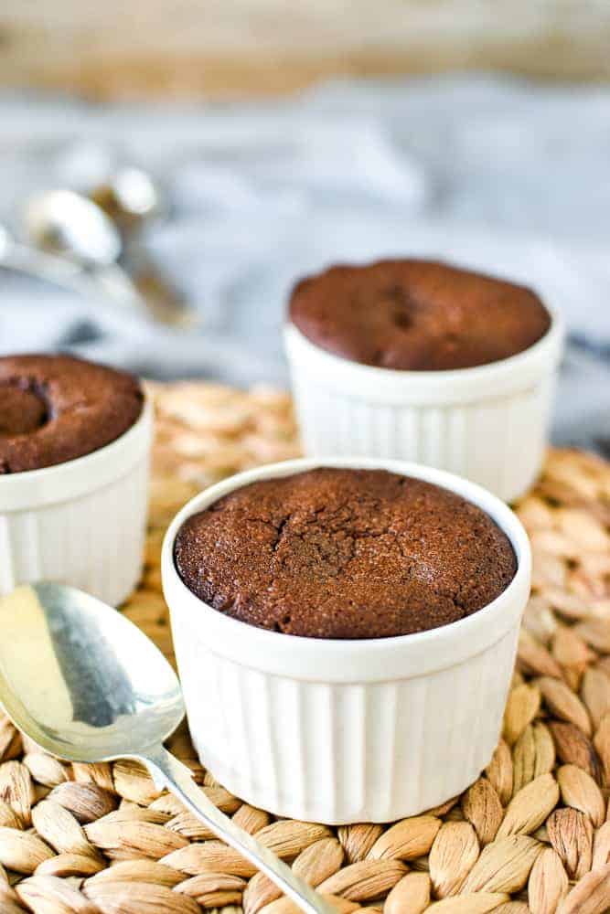 An easy Chocolate Pudding Recipe that is so rich, gooey and decadent! These puddings a super quick to make. #chocolatepuddingrecipe #chocolatepudding #chocohotopots #nigellasrecipes #chocolatedessert Close up of baked chocolate pudding