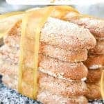 two stacks of sponge fingers tied together with a gold ribbon