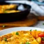 Wedge of frittata on a white plate.