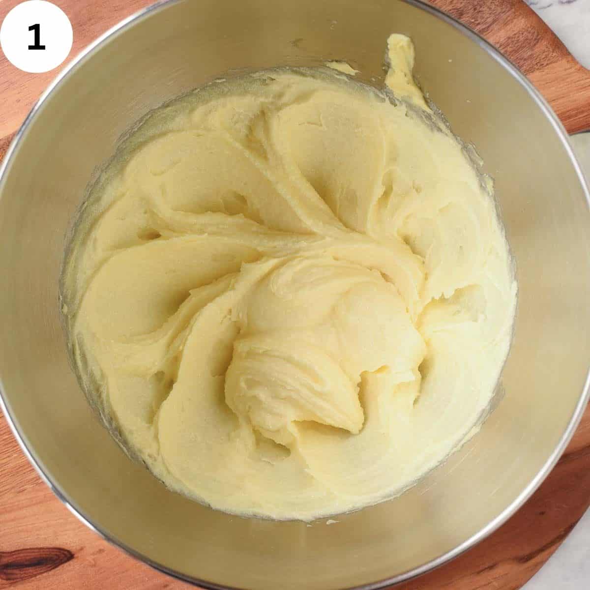Creamed butter and sugar in a bowl.
