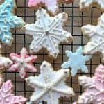 decorated sugar cookies on black wire rack viewed from above.