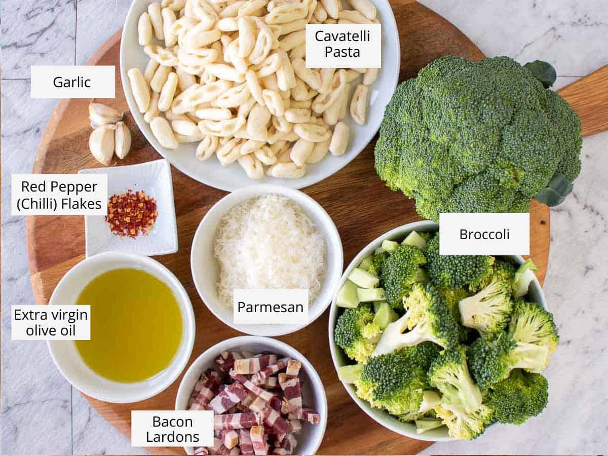 Overhead view of ingredients for broccoli pasta as in the recipe card.