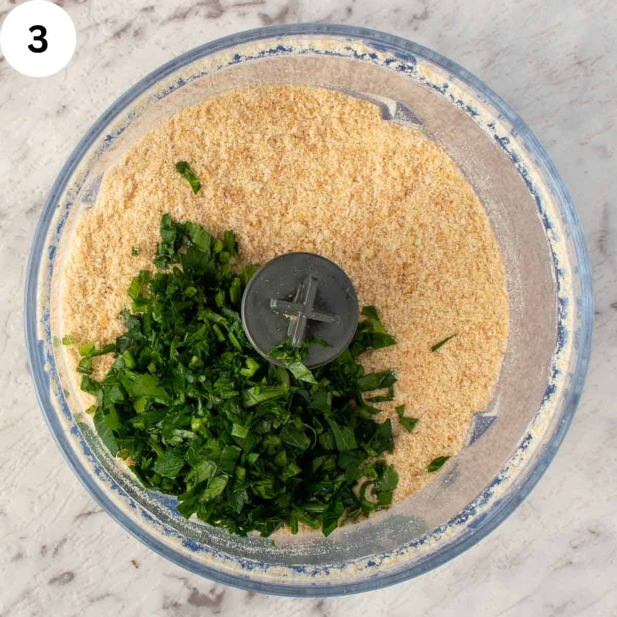 Bread crumbs and chopped fresh parsley in a food processor.