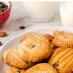 image with text. text reads "Delish gluten free almond flour cookies". image is cookies on white plate.