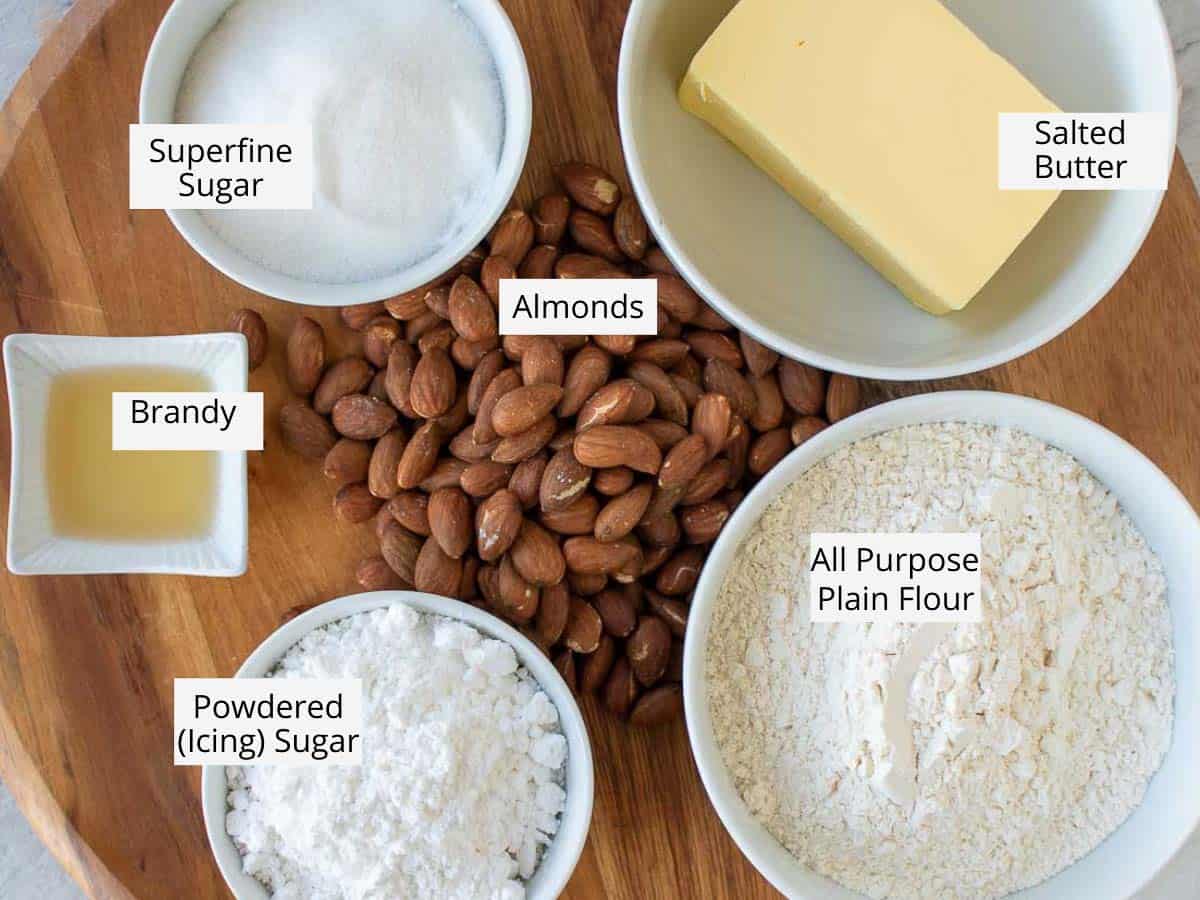 Ingredients to make the cookies prepared on a wooden board.