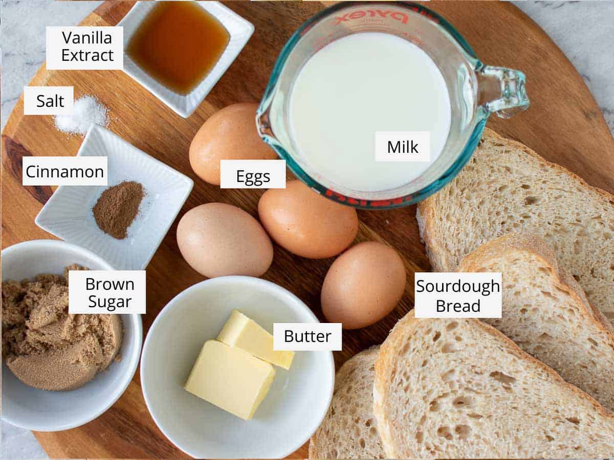 All the ingredients to make the recipe prepared on a wooden cutting board.