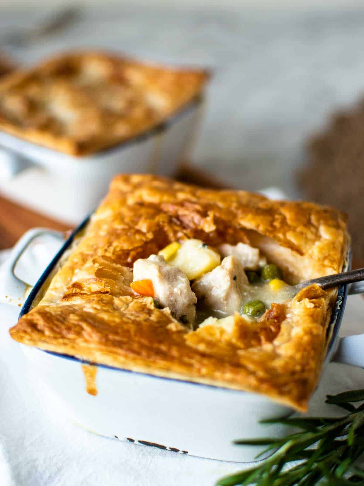 An instant pot chicken pot pie cut open and served with a spoon.