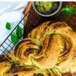 Sliced braided bread with pesto swirl.
