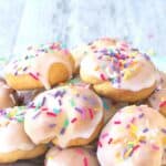 Italian knot cookies on a white plate on a sky blue cloth.