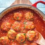 Italian Sausage Meatballs in tomato sauce in a pan viewed from above.