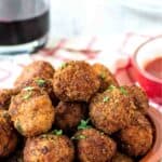Fried Meatballs piled into a shallow terracotta bowl.