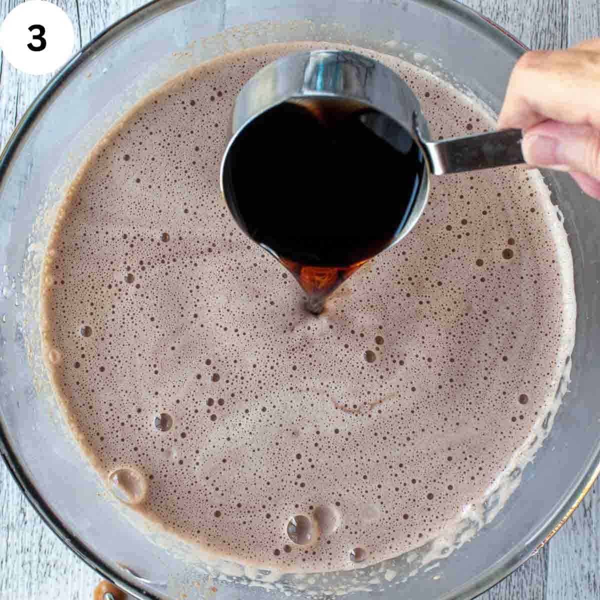 Add dark wine to a frothy milk mixture.