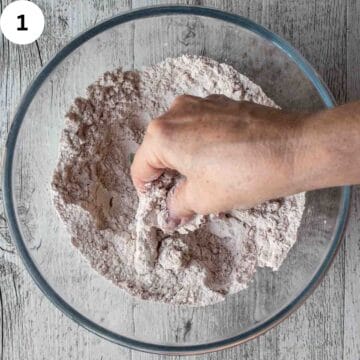 Rubbing butter into dry ingredients.