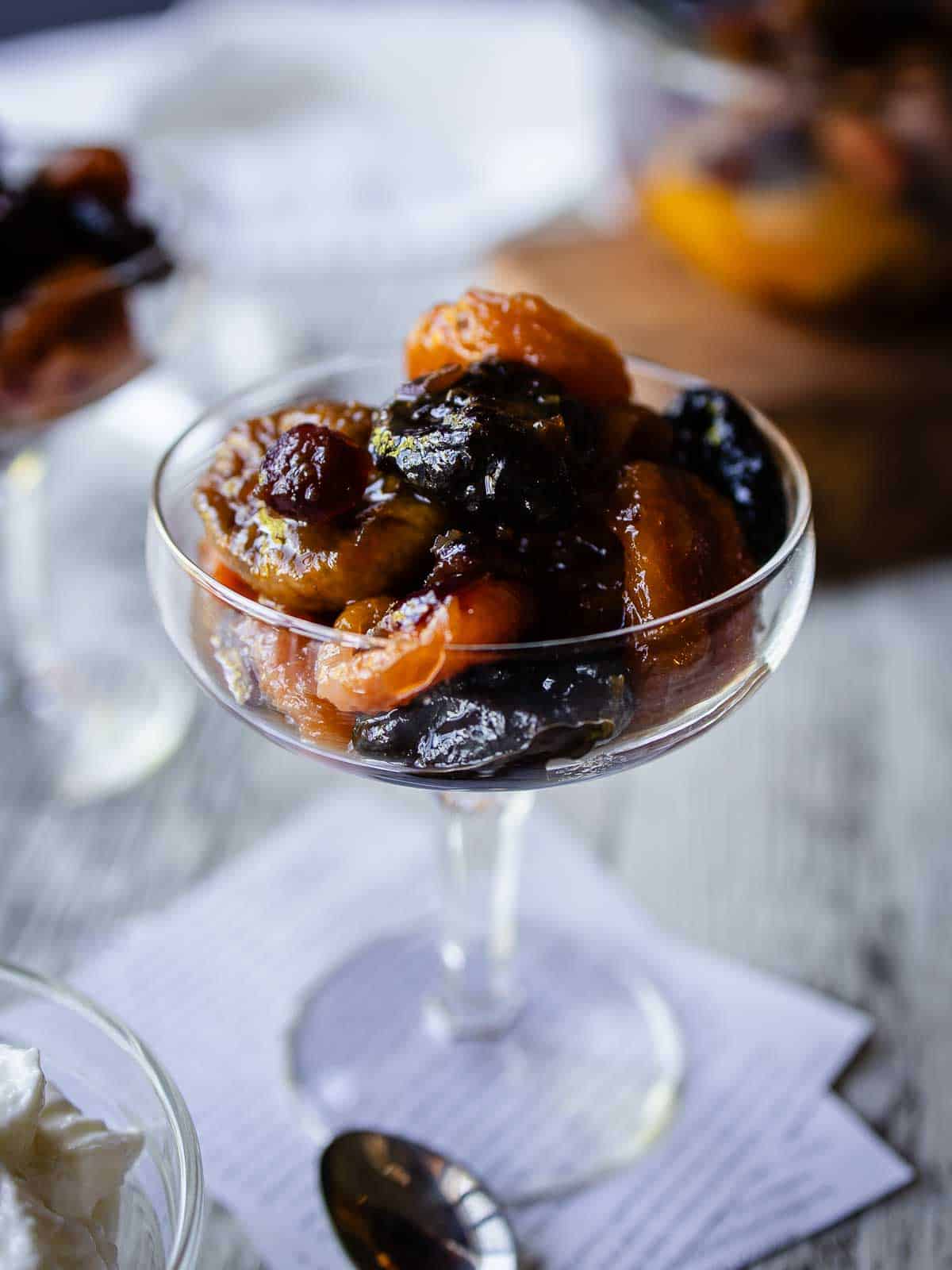 Dried Fruit Compote in a coupe glass.