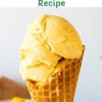 Mango gelato in a waffle cone.