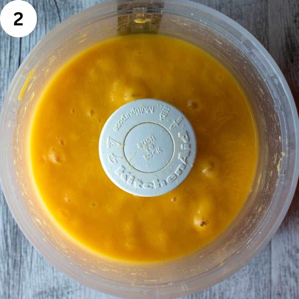 Mango puree in a food processor viewed from above.