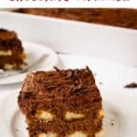 Large square piece of Chocolate Tiramisu on a white plate.