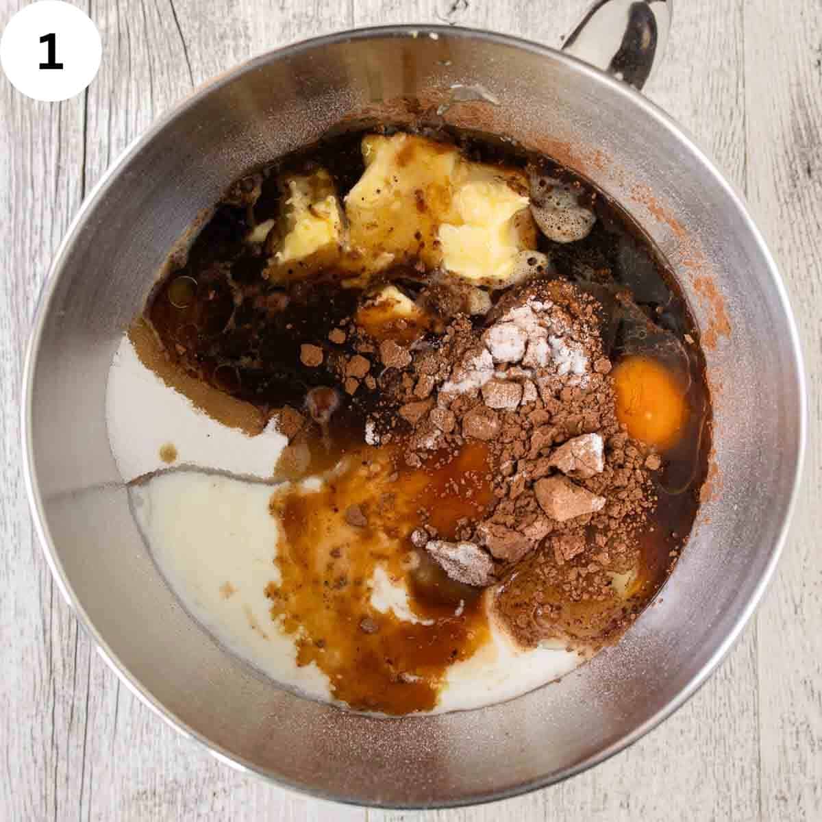 Ingredients for cake batter in a stainless bowl.