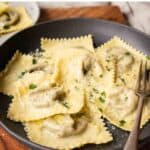 Mushroom Ravioli in a shallow bowl with a sprinkle of chopped parsley