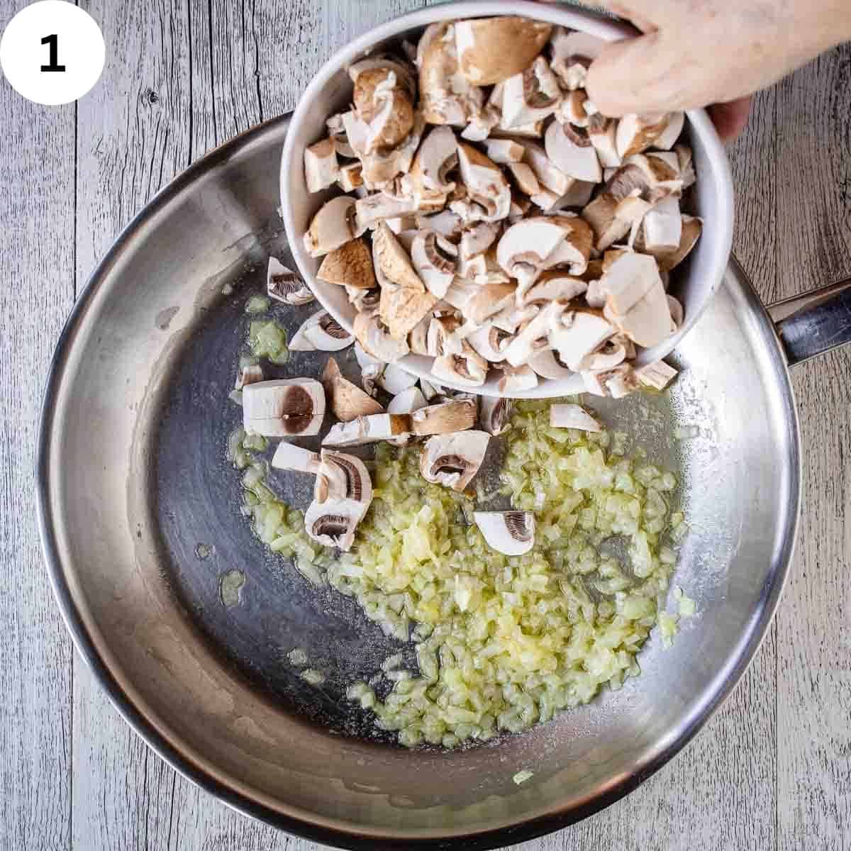 Adding chopped mushrooms to a pan of sauteed onions.