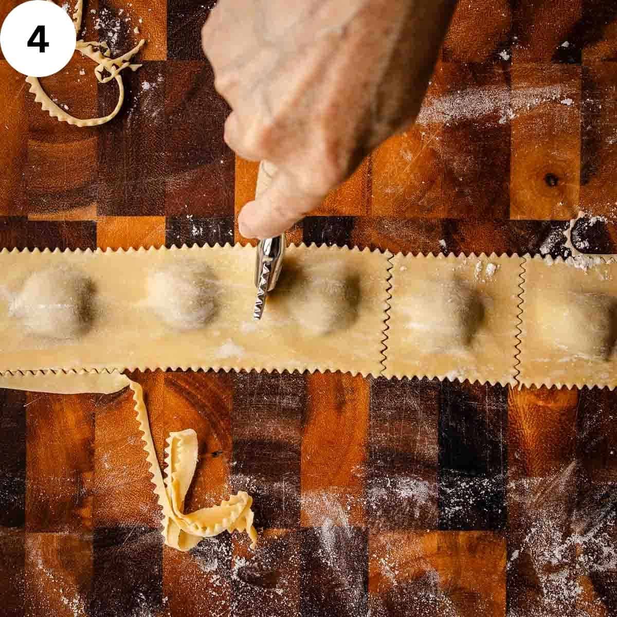 Cutting filled pasta into squares.