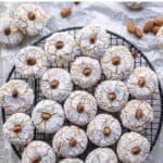 Amaretti Cookies on a round wire rack viewed from above.