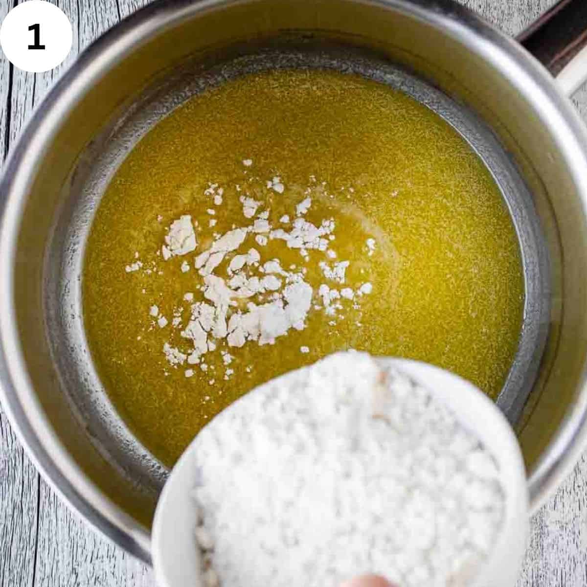Adding flour to melted butter.