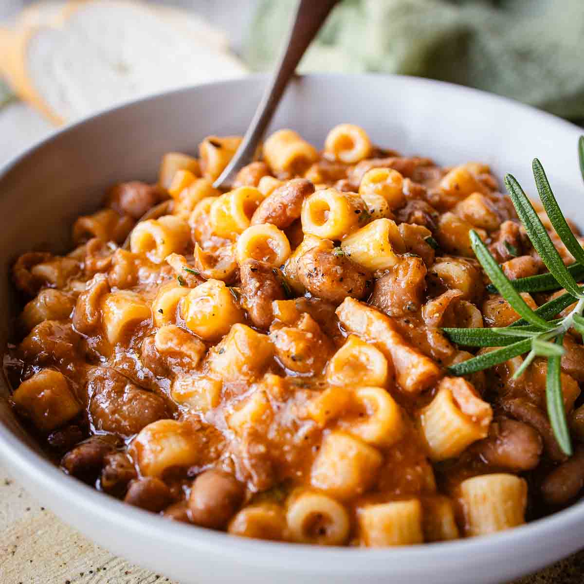 Authentic Italian Pasta e Fagioli Recipe prepared and in a bowl with a spoon.