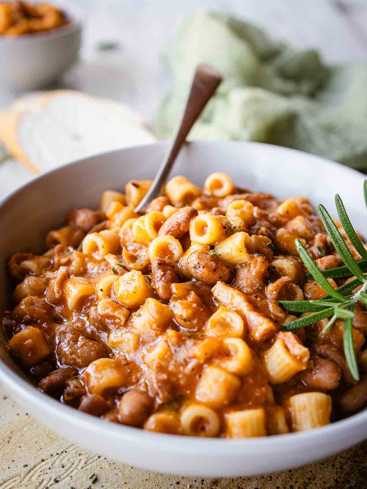 Authentic Italian Pasta e Fagioli Recipe prepared and in a bowl with a spoon.