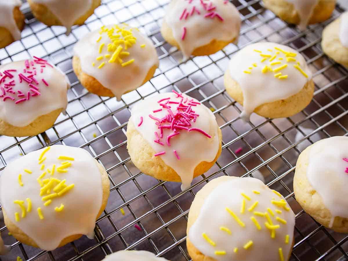 Overhead close up of cookies with glaze and nonpareils.