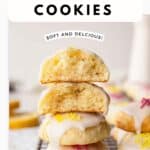 Lemony Ricotta Cookies piled up like a tower with two at the top broken in half.
